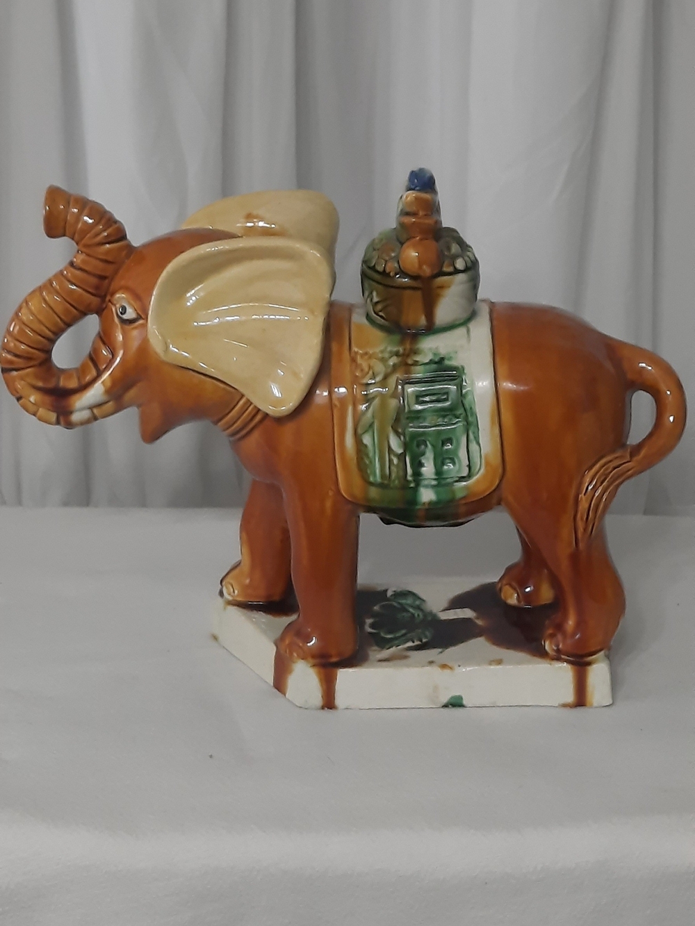 Brown Ceramic Elephant Figurine with Green Saddle